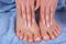 Beauty and Elegance: Pedicure and Manicure on Young Female Feet and Hands