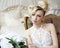 Beauty emotional blond bride in luxury interior