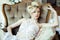 Beauty emotional blond bride in luxury interior