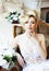 Beauty emotional blond bride in luxury interior