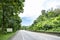 Beauty empty highway road with lamp post and tree on cloudy and blue sky day background