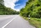 Beauty empty highway road and tree on cloudy and blue sky day background