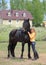 Beauty equestrian model lead a horse through a ranch