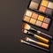 Beauty essentials Makeup brush and palette on a black background