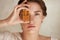 Beauty Face. Close Up Portrait Of Woman With Bottle Of Essential Oil. Beautiful Model With Glowing Facial Skin.