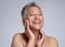 Beauty, face and happy mature woman, glowing skincare and dermatology of anti aging cosmetics on grey studio background