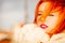 Beauty face redhaired woman in warm clothing outdoor