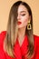 Beauty and fashion. jewelry earrings. Girl in red jacket. hair beauty and hairdresser salon. Fashion portrait of elegant