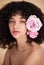 Beauty, flowers and portrait of woman with makeup, cosmetics and hair care for wellness, glamour and glow. Aesthetic