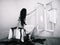 Beauty girl cuting her hair in empty fearing room halloween ghost