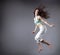 Beauty girl dance on grey background