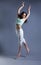 Beauty girl dance on grey background. person jumping, flying in the air