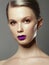 Beauty girl. High fashion look with violet lips