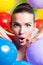 Beauty Girl Portrait with Colorful Makeup, Nail polish and Accessories. Colourful Studio Shot of Funny Woman. Vivid Colors.