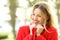 Beauty girl warmly clothed wearing red jacket in winter