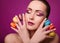 Beauty glamor fashion model girl with colourful makeup and macaroons.