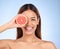 Beauty, grapefruit and woman for face portrait with a smile for skincare dermatology and vitamin c. Model on blue