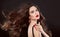 Beauty hair. Red manicure. Brunette girl with makeup and long sh