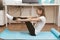 Beauty and health at home. Yoga classes over the Internet. Young woman doing exercises