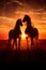 Beauty of horses\\\' silhouettes against an abstract sunset. The scene is both dramatic and serene