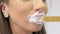 Beauty injections. Lip augmentation procedure. Beautician prepares lips for lip augmentation. The cosmetologist in