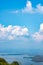 The beauty inside the dam and the houseboat on the bright sky.