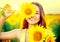 Beauty joyful teenage girl with sunflower