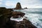 Beauty landscape of white sands malikan beach ambulu jember indonesia, the unique rock formation and giant waves