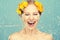 Beauty laughing girl with splashes of water and yellow flowers