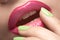 Beauty macro make-up with bright mint green color on nails