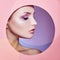 Beauty makeup cosmetics nature fashion woman in a round hole circle in pink paper, copy space advertising. Professional makeup