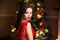 Beauty makeup. Elegant brunette woman portrait in red dress ove