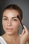 Beauty makeup. Eyebrows Care. Beautiful woman shaping brows with comb.