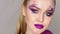 Beauty Makeup. Purple Make-up and Colorful Bright Nails. Beautiful Girl Close-up Portrait