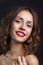 Beauty Model Woman with Long Brown Wavy Hair. Healthy Hair and Beautiful Professional Makeup. Red Lips . Gorgeous Glamour Lady