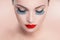 Beauty model woman with red lips and blue false eyelashes