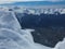 Beauty of Nature - Part of a snowdrift with a blurred view of the snow-capped peaks in the background.