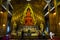 Beauty orange buddha statue for thai people and foreign travelers travel visit respect praying blessing with holy mystery at Wat