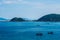 Beauty panorama skyline in pure blue azure sea, white clouds clear sky, mountain island background, sailing boats. Ideal