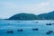 Beauty panorama skyline in pure blue azure sea, white clouds clear sky, mountain island background, sailing boats. Ideal