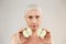 Beauty portrait of an attractive half naked elderly woman