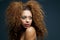 Beauty portrait of a beautiful female fashion model with curly hair