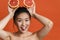 Beauty portrait of a cheerful topless young asian woman