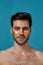 Beauty portrait of confident caucasian naked guy with golden gel under eye patches looking at camera, posing isolated