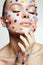 Beauty portrait of girl with colored balls makeup