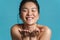 Beauty portrait of a smiling topless young asian woman