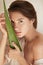 Beauty Portrait Of Woman With Aloe Vera Leaf. Beautiful Model With Perfect Glowing And Hydrated Skin.