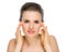 Beauty portrait of woman checking facial skin