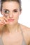 Beauty portrait of woman using eyelash curler
