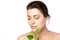 Beauty portrait of a young woman with green leaves. Natural skincare, health and spa treatment concept